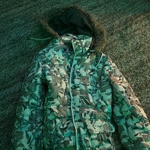 Selling a coat, fuzzy hood very warm, multi colored